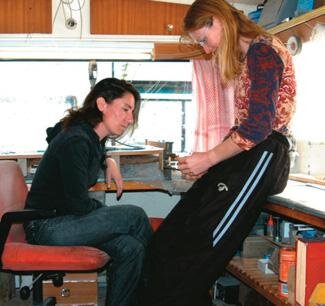 Lilach Paul (left) and Fiona Mead examine a bone carving. “It’s a learning process.”