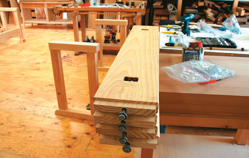 For bolted-on benchtop end rails and long rails in base, mortises were routed in the underside to locate captured nuts