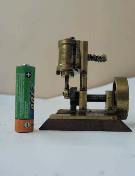 A double-acting single-cylinder steam engine built from scrap brass