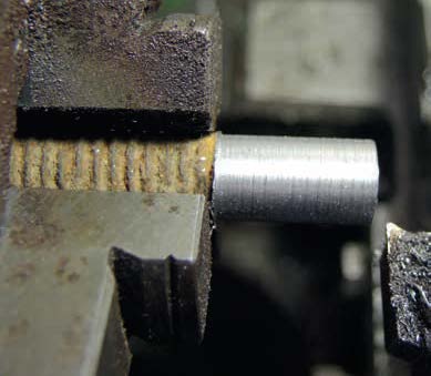 The beginning of making the outer body—a piece of old mild steel was machined to the diameters to take ¼ inch (6.35 mm) thread and a hexagon.