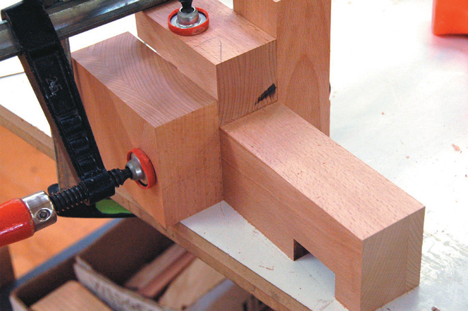 Extra blocks clamped in place to steady router while running groove