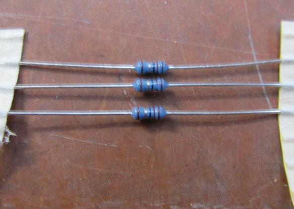 Three normal resistors. Resistors of less than 100 ohms will just melt.