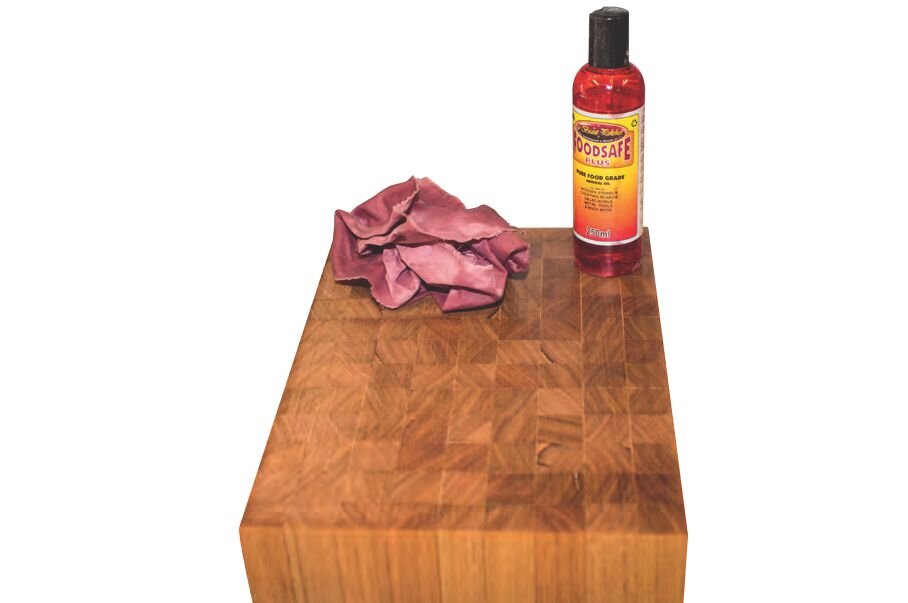 Coat chopping board with food-safe mineral oil