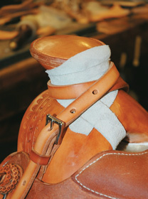 Mule-hide wrapped horn and rope strap