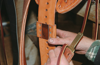 Placing a keeper on a leather
