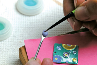 Pick up a small amount of enamel on the brush
