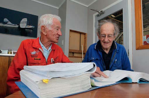 Former air force engineers Mike Jackson(left) and Donr Barr with the maintenance manual