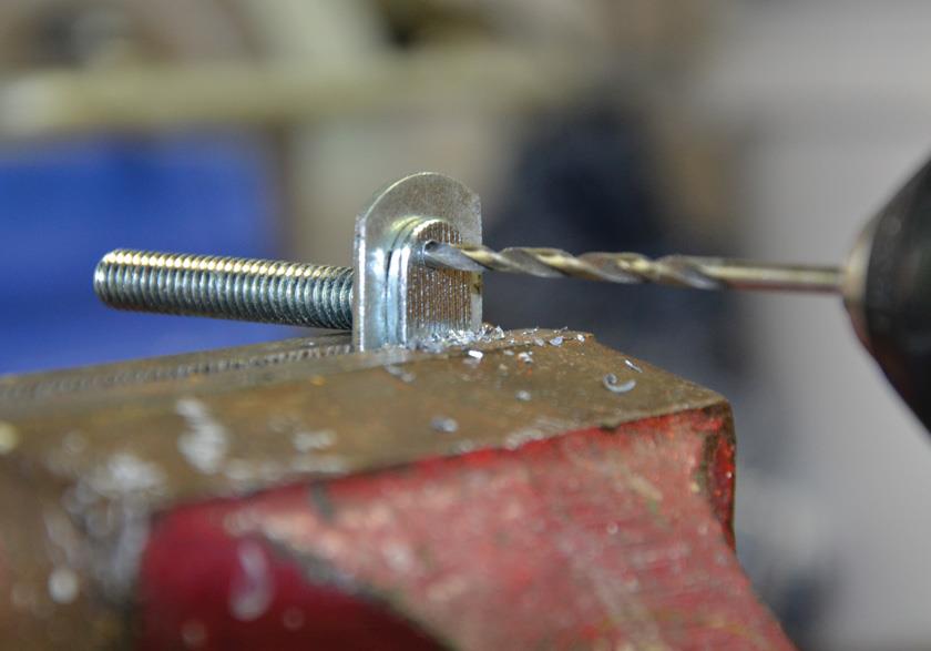 Drilling a 3 mm hole through T bolt and washer.