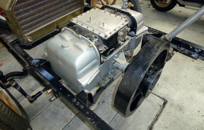 The unusual 113-year-old engine of the Arrol Johnston car—two cylinders and four pistons. Two pistons on each side oppose the other pair like a Boxer engine with one crankshaft and two cylinder heads at opposite ends.