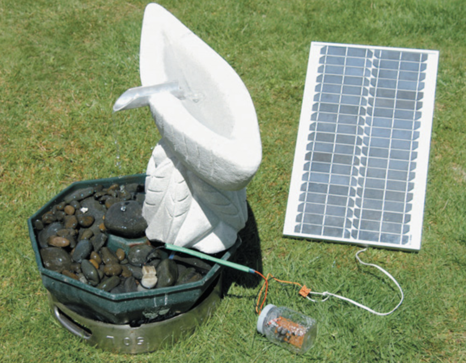 Solar-powered water feature. Note the half-submerged windscreen washer pump.