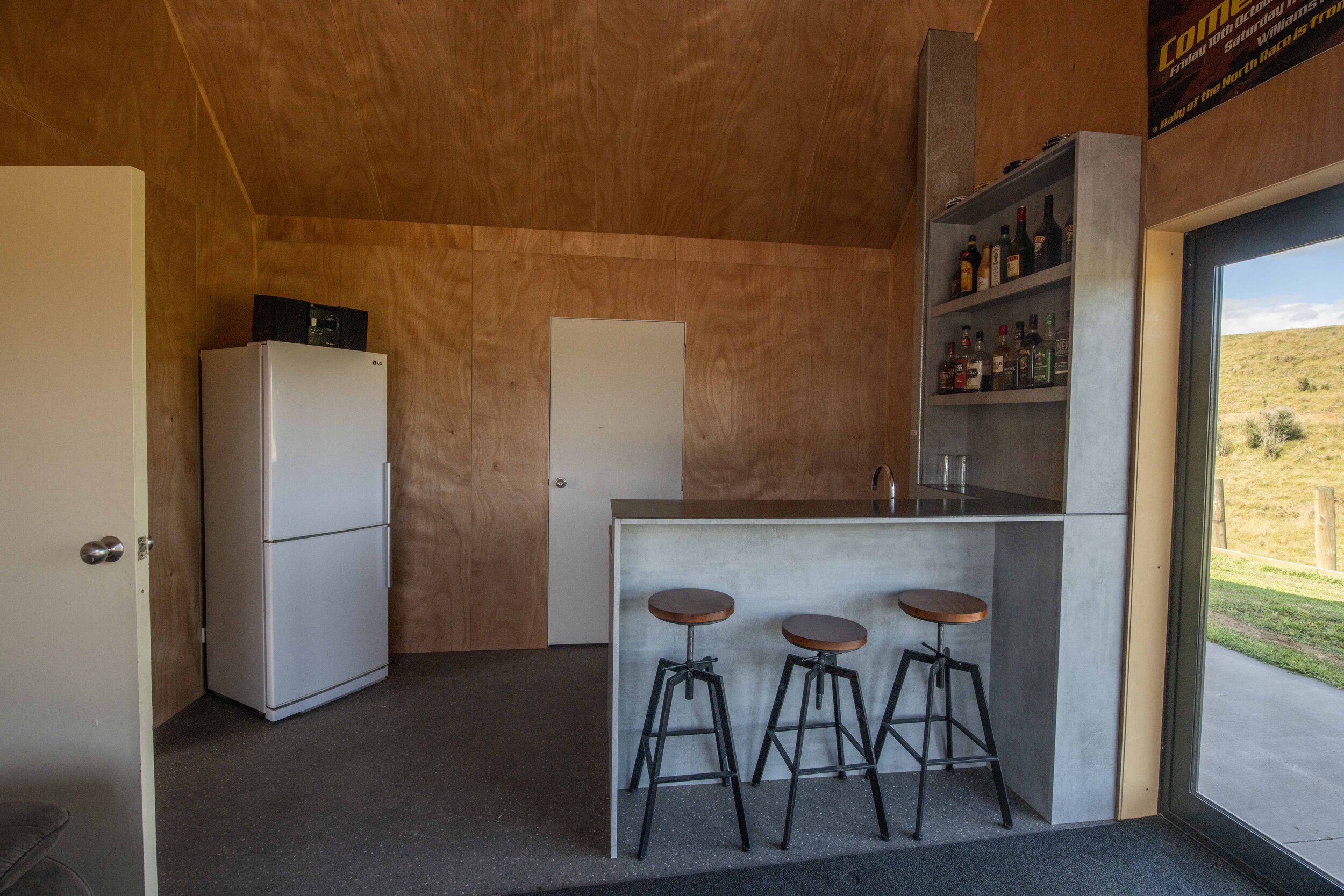 Plywood panelling creates a cosy man cave