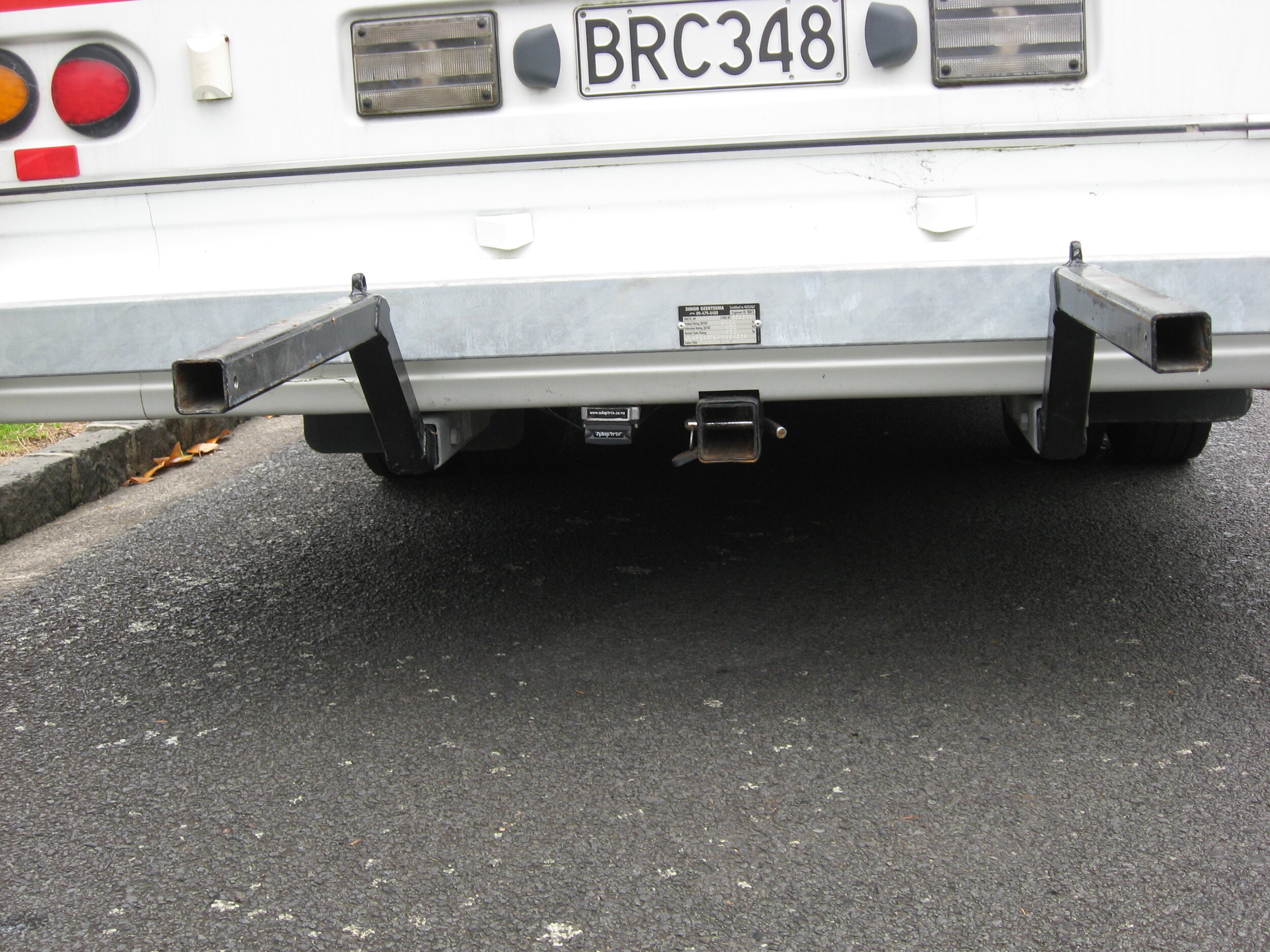 Carrier arms slot into towbar assembly
