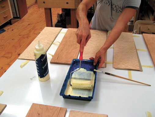 Use a roller for even glue coverage. Apply glue only to the substrate.