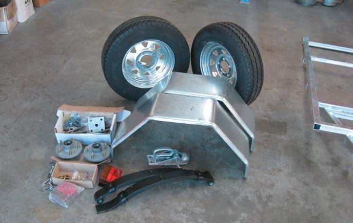 The trailer kit, including mudguards, wheels, lights, coupling and springs