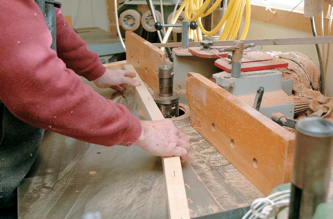 Shaping the legs with the template, this could be done on a router table too