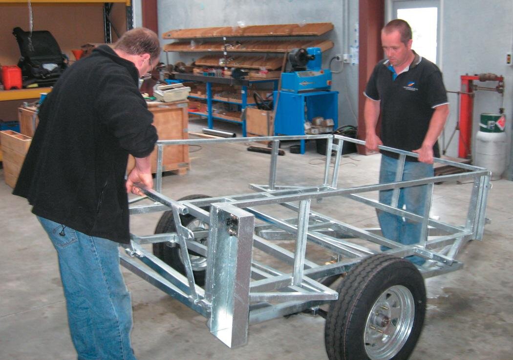 Lifting top frame into place
