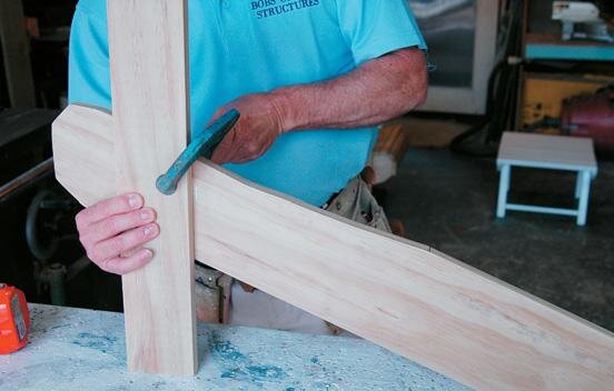 With the foot flat to the bench, clamp the upright in place